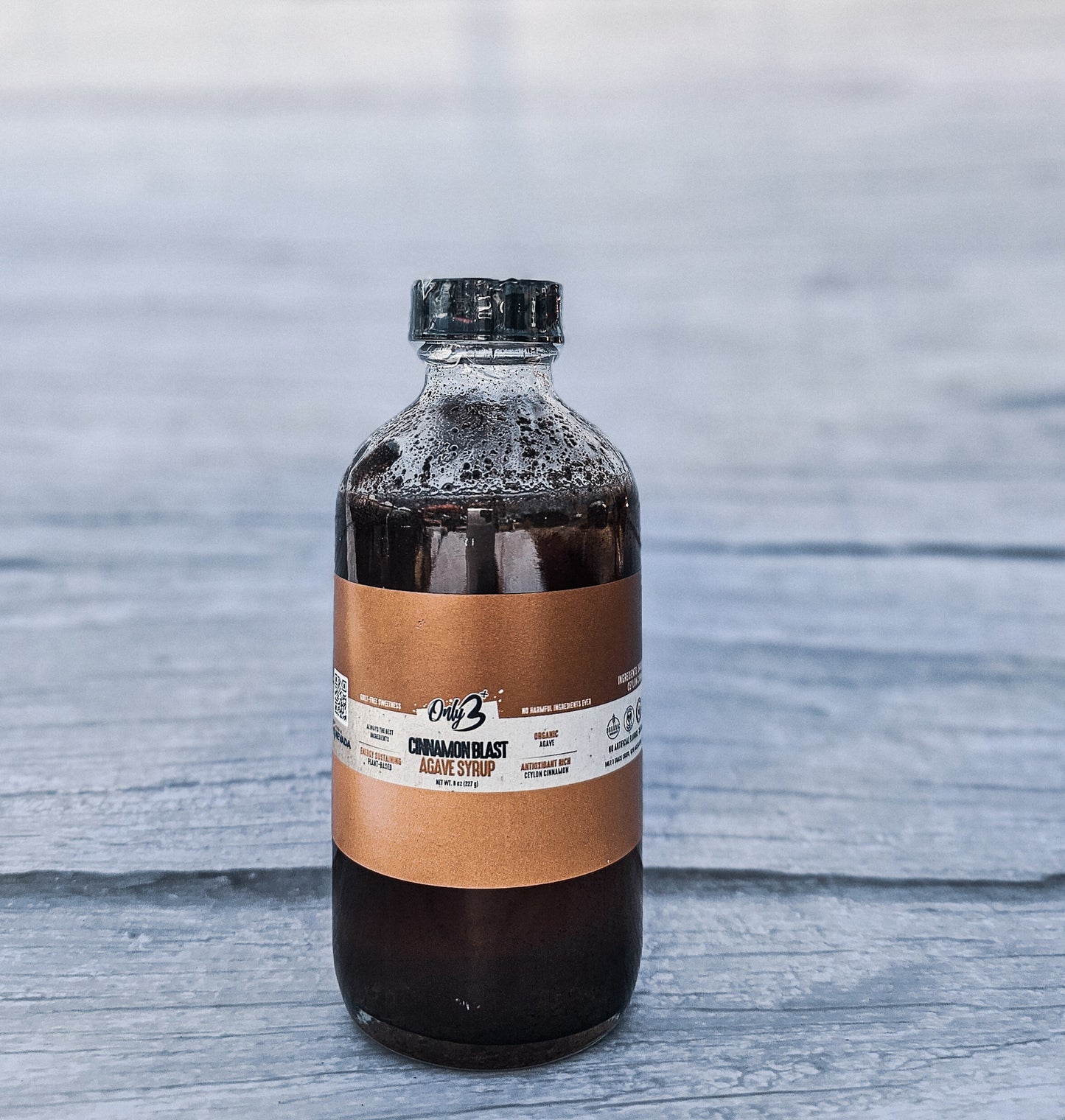 A bottle of Cinnamon Blast Agave Syrup